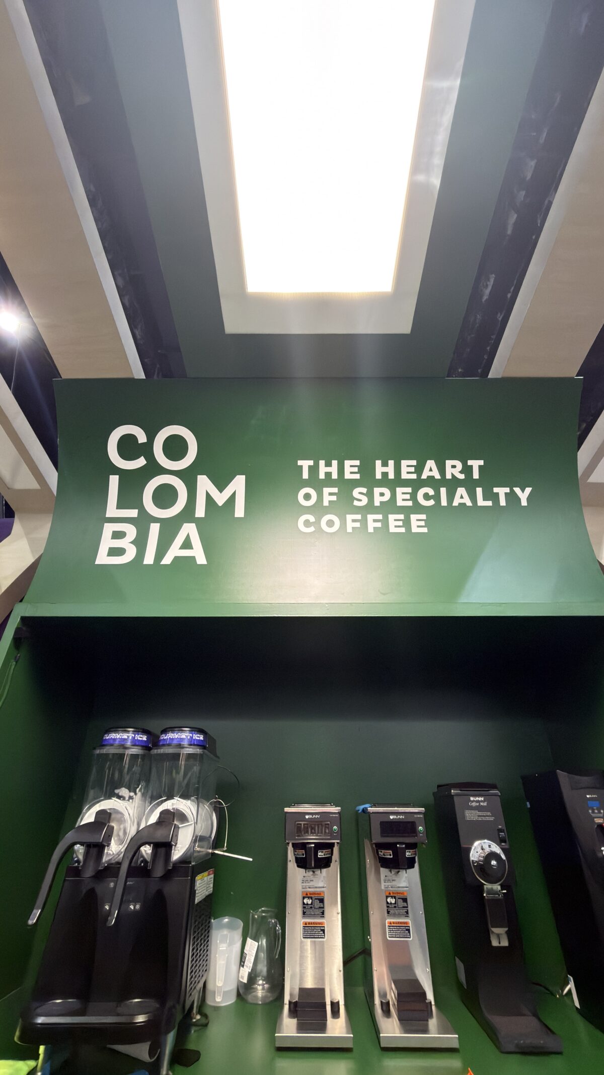 Applied brand graphics and millwork detail at Café de Colombia activation